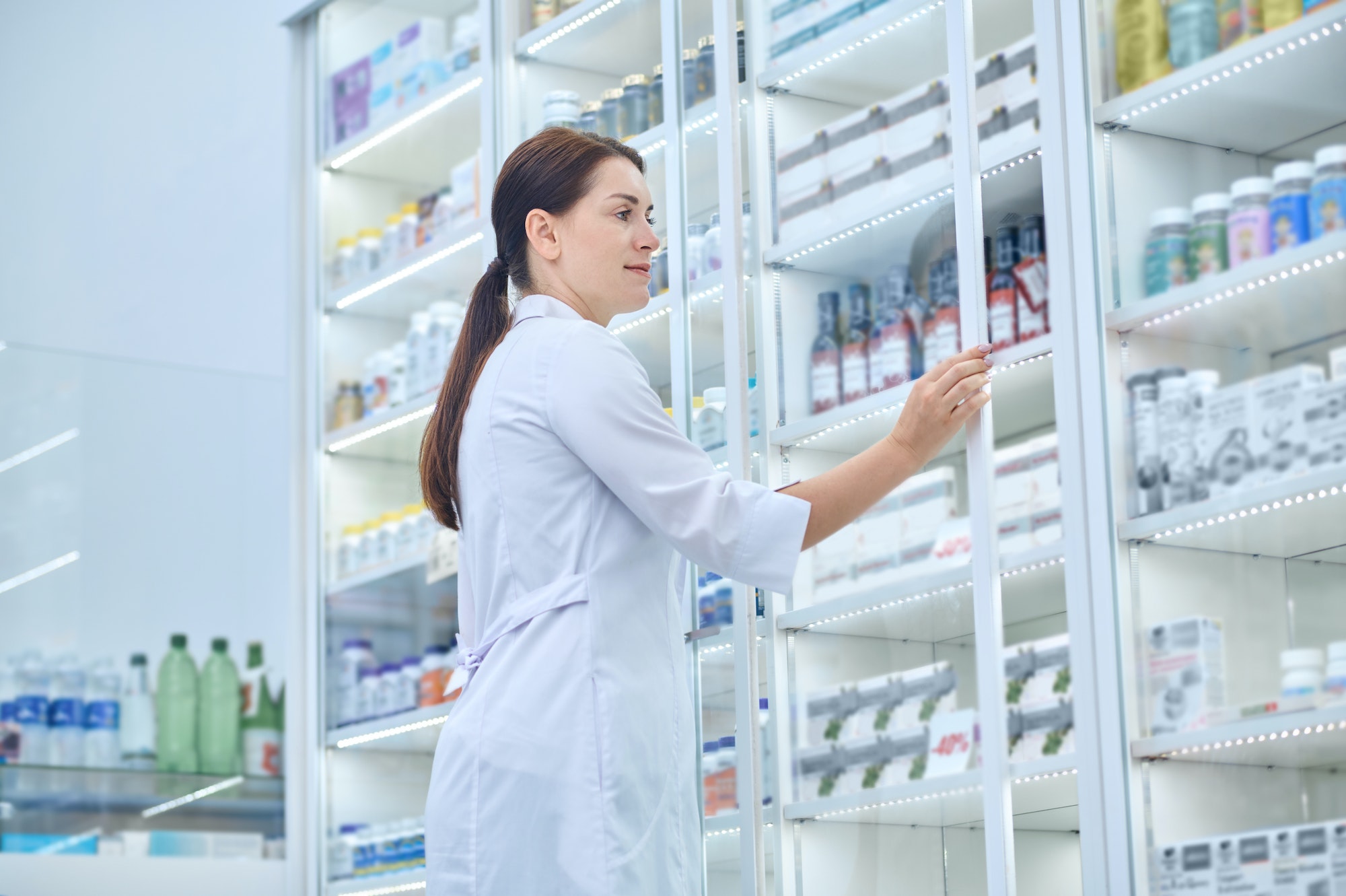 Pharmacist checking medicines in a drugstore